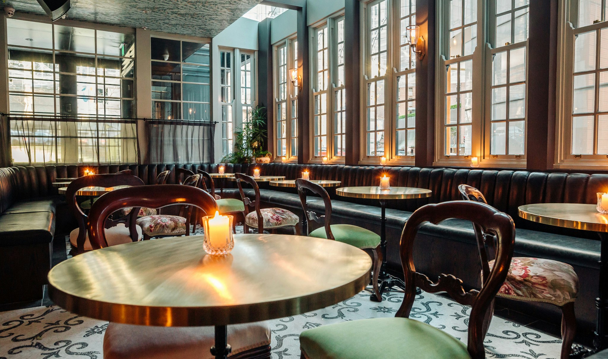 Dramatic window designs light a restaurant's main space.
